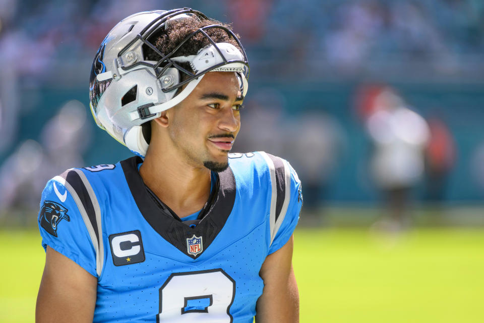 Carolina Panthers quarterback Bryce Young (9) smiles on the field before an NFL football game against and the Miami Dolphins, Sunday, Oct. 15, 2023, in Miami Gardens, Fla. (AP Photo/Doug Murray)