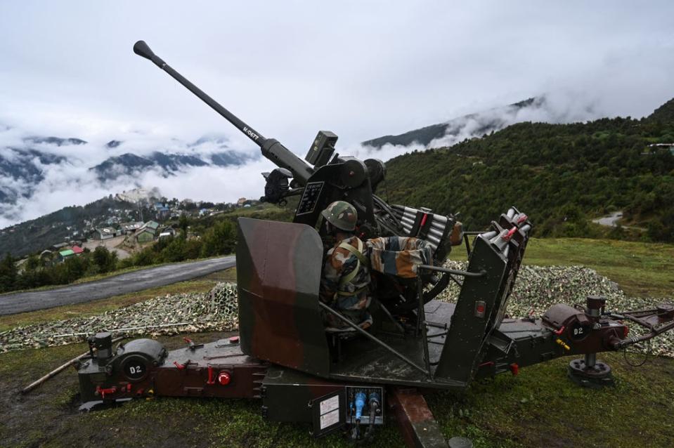 An Indian Army soldier in Tawang, near the Line of Actual Control (LAC), in the northeast Indian state of Arunachal Pradesh on 20 October 2021 (AFP via Getty Images)