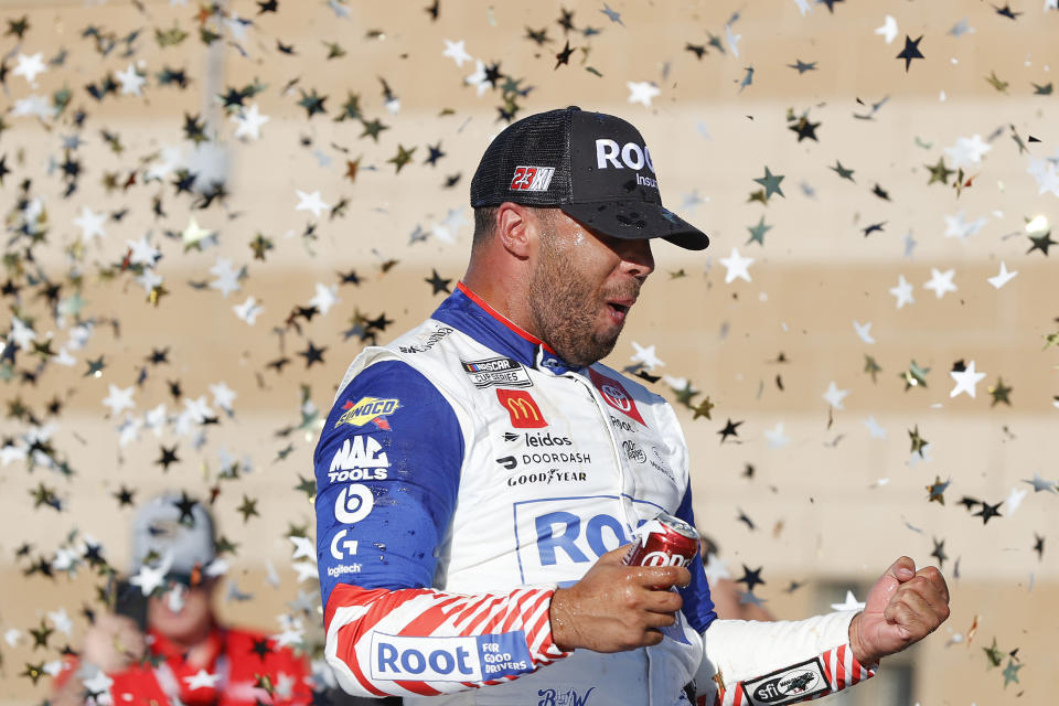 KANSAS CITY, KANSAS - SEPTEMBER 11: Bubba Wallace, driver of the #45 ROOT Insurance Toyota, vl the NASCAR Cup Series Hollywood Casino 400 at Kansas Speedway on September 11, 2022 in Kansas City, Kansas. (Photo by Meg Oliphant/Getty Images)