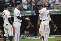 Cleveland Guardians' David Fry, center left, congratulates Bo Naylor, right, for his grand slam with Tyler Freeman (2), and Jose Ramirez during the sixth inning of a baseball game against the Los Angeles Angels in Cleveland Saturday, May 4, 2024. (AP Photo/Phil Long)