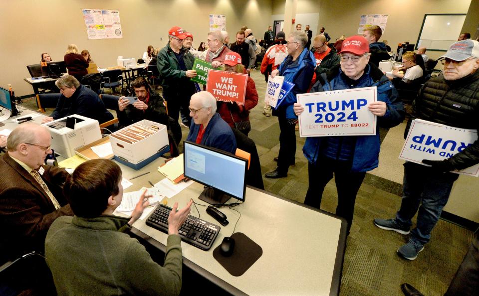 Supporters of presidential candidate Donald Trump submit nomination papers at the llinois State Board of Elections in Springfield on Thursday.