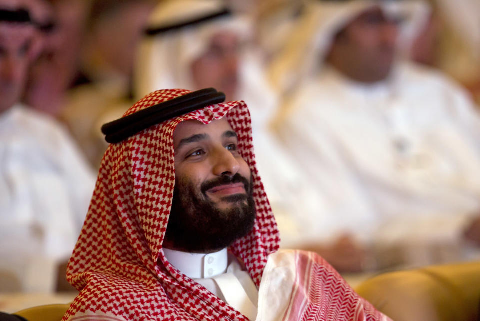 FILE - In this Oct. 23, 2018, file photo, Saudi Crown Prince Mohammed bin Salman smiles as he attends the Future Investment Initiative summit in Riyadh, Saudi Arabia. Lured by a long-looming stock offering of Saudi Arabia's massive state-run oil company, investors and business leaders have returned to the kingdom's capital for an investment forum overshadowed last year by the assassination of Washington Post columnist Jamal Khashoggi. (AP Photo/Amr Nabil, File)