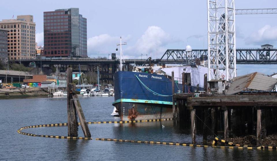 The Pacific Producer, a large fishing vessel shown on Tuesday, April 4, 2023, has been tied up at the old Martinac shipyards on the Thea Foss Waterway in Tacoma, Washington, since August. The ship is 77 years old, nearly 200 feet long, and has a history of environmental and safety concerns and fines.