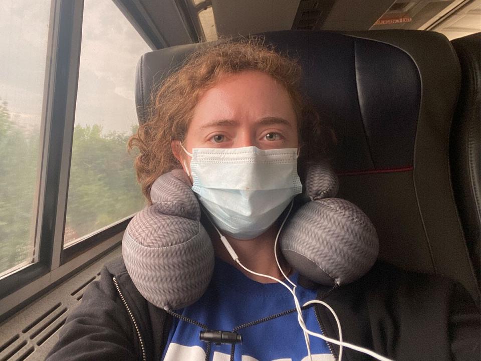 jenny silber seflie on amtrak train with her mask on