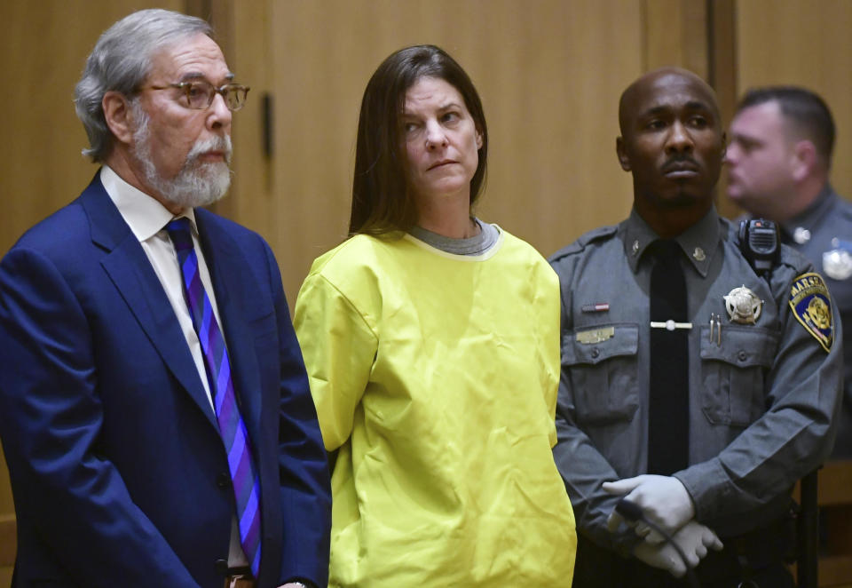 Michelle Troconis, center, is arraigned on conspiracy to commit murder charges in Stamford Superior Court on Jan. 8, 2020, in Stamford, Conn.  / Credit: Erik Trautmann / AP