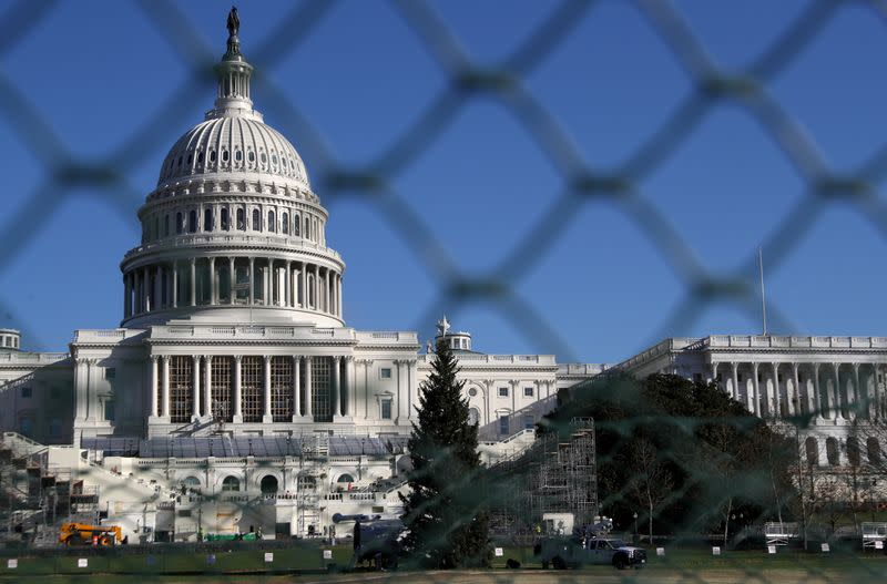 FILE PHOTO: Construction for the upcoming presidential inauguration ceremony is seen outside of the U.S. Capitol Building in Washington