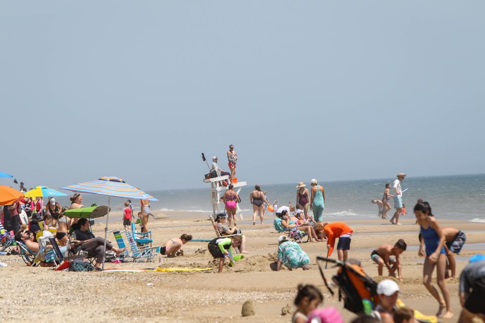 Lifeguards watch over a crowded Bethany Beach on a warm breezy Wednesday, June 10. They've been trained to work in teams for rescues, wearing masks and gloves when possible due to coronavirus.