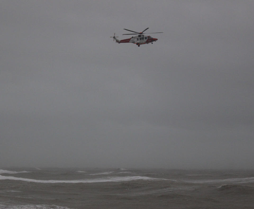Handout photo from Hastings Council showing a RNLI helicopter off the coast of Hastings searching for a missing surfer, who was later found safe. PA Photo. Picture date: Sunday February 9, 2020. See PA story WEATHER Storm. Photo credit should read: Hastings Council /PA Wire  NOTE TO EDITORS: This handout photo may only be used in for editorial reporting purposes for the contemporaneous illustration of events, things or the people in the image or facts mentioned in the caption. Reuse of the picture may require further permission from the copyright holder. 