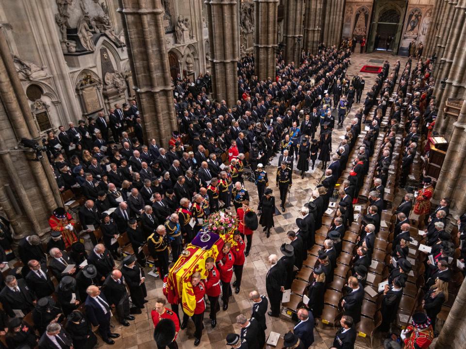 Ariel shot of queen's coffin being carried in Westminster abbey during funeral