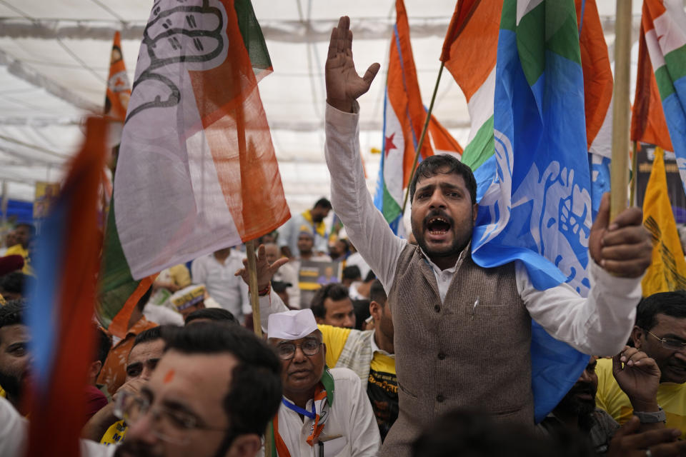 Supporters from various opposition parties shout anti government slogans during the 'Save Democracy' rally organized by INDIA bloc, a group formed by opposition parties, in New Delhi, India, Sunday, March 31, 2024. The "Save Democracy" rally was the first major public demonstration by the opposition bloc INDIA against the arrest of New Delhi's top elected official and opposition leader Arvind Kejriwal on March 21, in a liquor bribery case. (AP Photo/Manish Swarup)