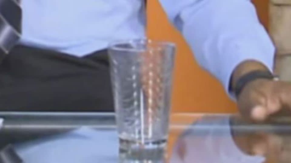 The glass that spooked viewers - and the presenters - when it moved across the table untouched. Photo: Tag News Media