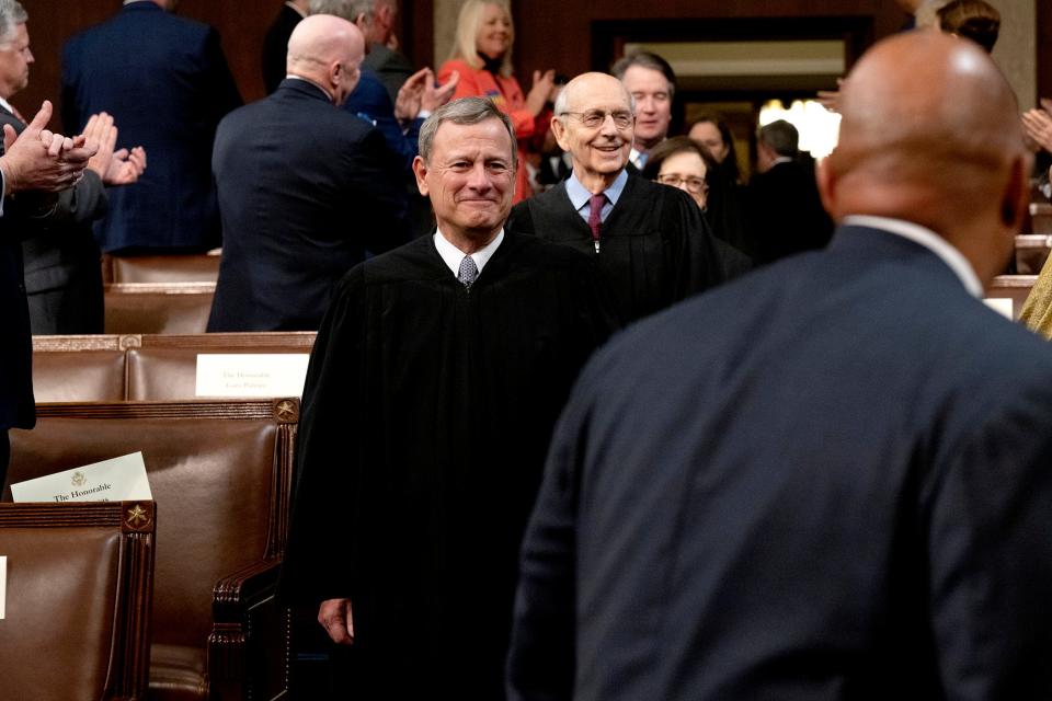 Supreme Court Chief Justice John Roberts, center, and Justice Stephen Breyer arrive for the State of the Union address by President Joe Biden to a joint session of Congress in the U.S. Capitol House Chamber on March 1, 2022.