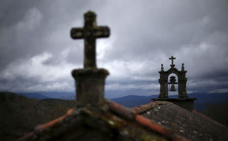 The bell tower of the church is seen in Povoa de Agracoes near Chaves, Portugal, April 19, 2016. REUTERS/Rafael Marchante