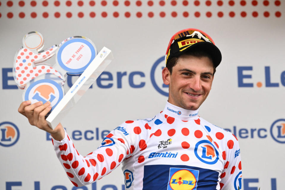 Lidl - Trek's Italian rider Giulio Ciccone celebrates on the podium with the the best climber's polka dot (dotted) jersey after the 16th stage of the 110th edition of the Tour de France cycling race, 22 km individual time trial between Passy and Combloux, in the French Alps, on July 18, 2023. (Photo by Marco BERTORELLO / AFP)