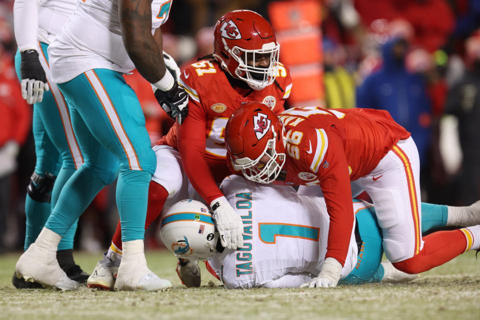 George Karlaftis #56 of the Kansas City Chiefs sacks Tua Tagovailoa #1 of the Miami Dolphins during the second quarter in the AFC Wild Card Playoffs at GEHA Field at Arrowhead Stadium on January 13, 2024 in Kansas City, Missouri.