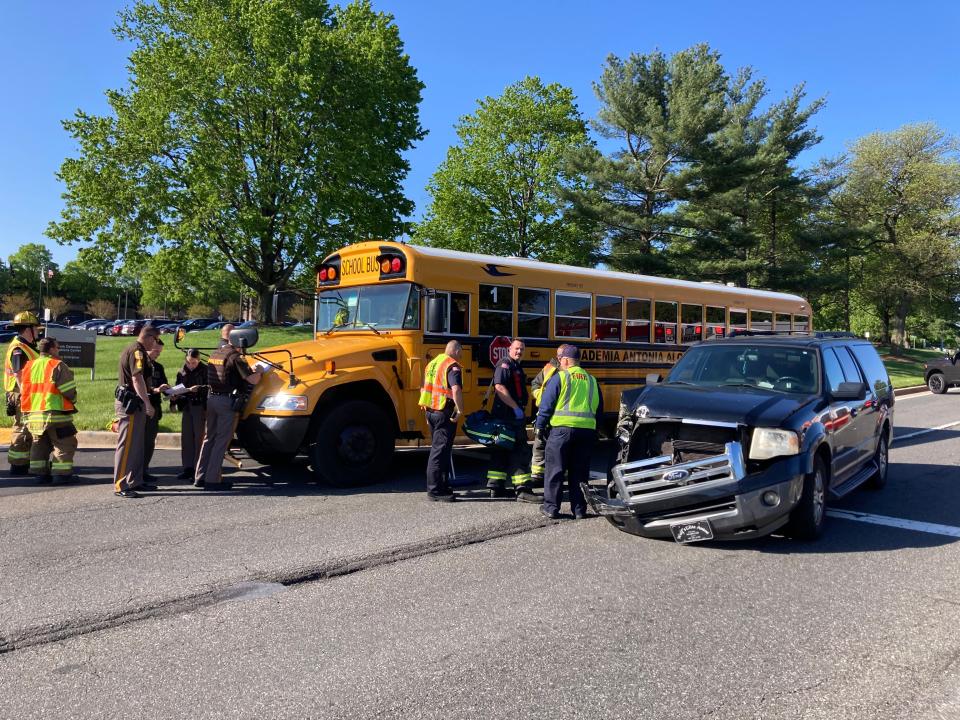 More than a dozen children and two adults were injured Monday morning in a crash between an SUV and a school bus near New Castle, according to first responder radio communications.
