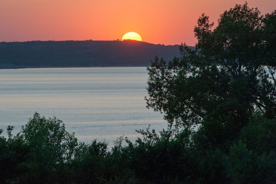 The sun sets over Tuttle Creek State Park just north of Manhattan.