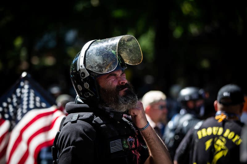 Alan Swinney reacts after being hit with pepper spray during a protest in Portland