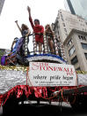 FILE - In this June 28, 2009 file photo, drag queens wave from a float that honors the 40th anniversary of the Stonewall uprising during New York's annual Gay Pride Parade. June 2019 Pride Month marks the 50th Anniversary of the Stonewall uprising with events that commemorate that moment and its impact through the last five decades. (AP Photo/Seth Wenig, File)