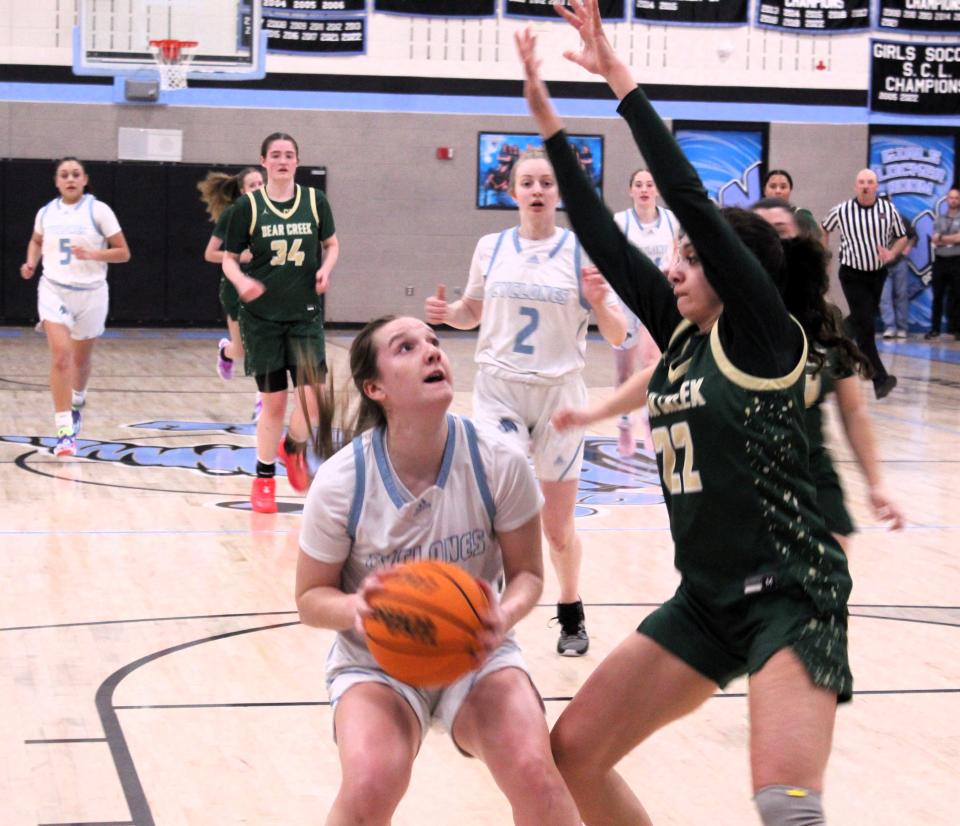 Pueblo West's Katie Peterson pump fakes on a shot against Bear Creek during their matchup in the Class 5A girls basketball playoffs at Pueblo West High School on Tuesday, February 20, 2024.