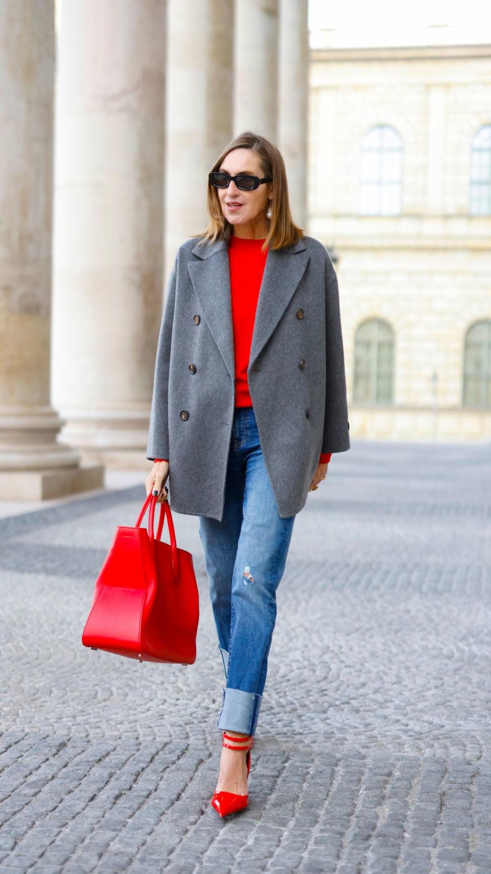 <p> Who said wearing jeans seven days a week has to be boring? This look is proof that jeans and a blazer are a trustworthy style to rely on. Dress it up with a pop of colour and pair a well-fitted pair of slim-leg jeans with a bright pop of red, match your jumper with the same shade of heels and bag and tie it all together with a grey woolly blazer. Now this is chic. </p>