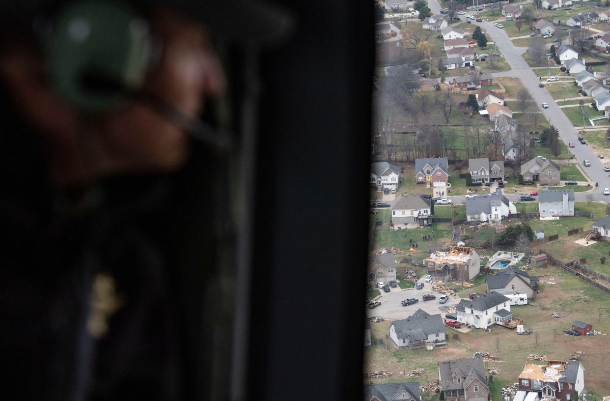 Gov. Bill Lee looks out the window down at the destruction left after a series of tornados swept through Tennessee, Sunday, Dec. 10, 2023.