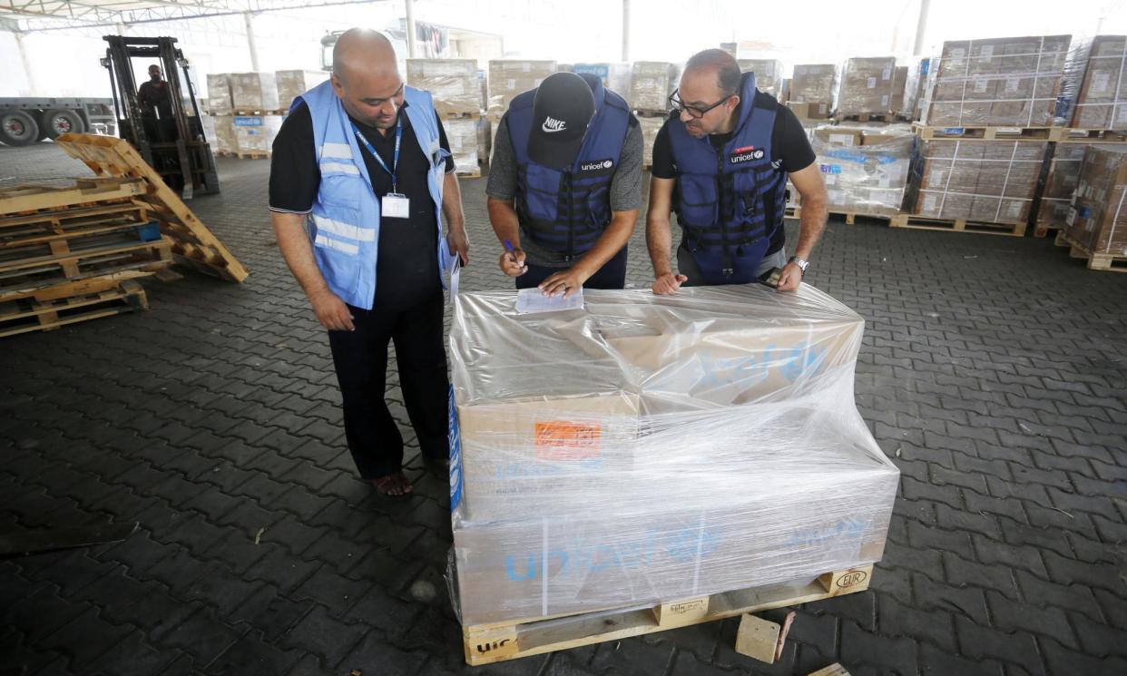 <span>UNRWA workers with a consignment of medical aid for hospitals in Gaza.</span><span>Photograph: Anadolu Agency/Anadolu/Getty Images</span>