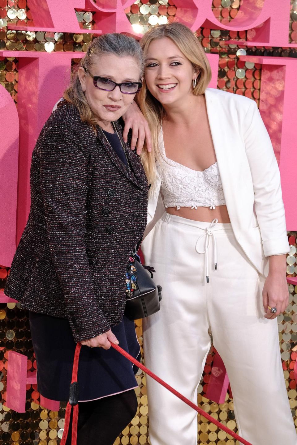 At the 2016 premiere of <em>Absolutely Fabulous: The Movie</em>, Fisher and Lourd pose for photos.