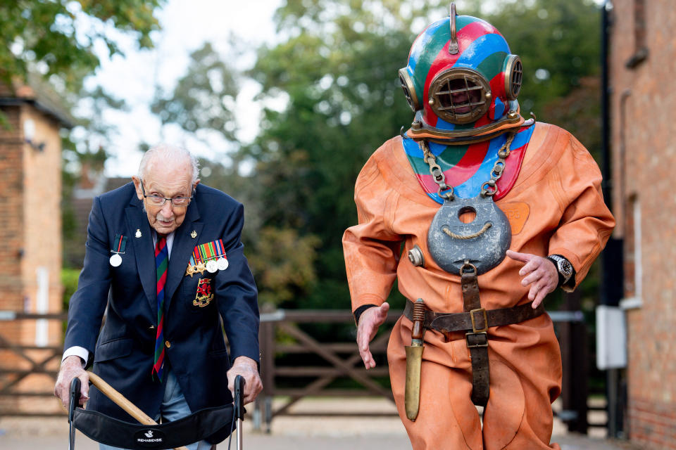 Captain Sir Tom Moore in Wootton, Marston Moretaine, Bedford with veteran fundraiser Lloyd Scott, who will attempt to climb the Three Peaks whilst wearing a deep sea diving suit.