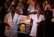 Students of a nursing college pray as they participate in a candle light vigil organized by a local politician in Bangalore, India, Thursday, Dec. 13, 2012, to condole the death of Jacintha Saldanha, a nurse at King Edward VII hospital in London, who killed herself after taking a hoax call from Australian DJs about the pregnant Duchess of Cambridge. (AP Photo/Aijaz Rahi)