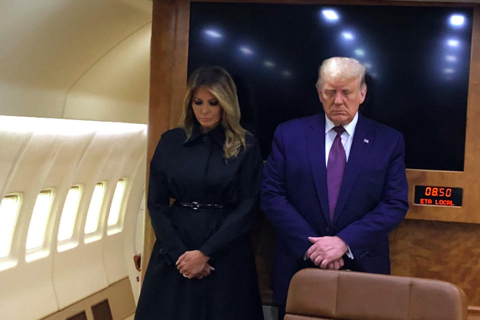 First lady Melania Trump and President Trump observe a moment of silence on Air Force One in honor of 9/11 victims on Friday. (Photo via White House press pool)