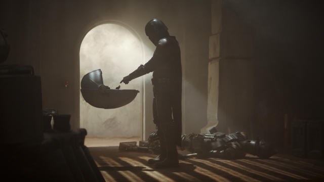 The Child meets the title character in 'The Mandalorian'. (Credit: Disney+)