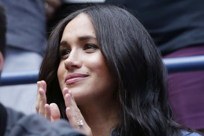 Meghan Markle, duchess of Sussex, claps her hands before Bianca Andreescu of Canada plays Serena Williams at the U.S. Open on September 7, 2019, at Arthur Ashe Stadium in New York City. Markle turns 42 on August 4. File Photo by John Angelillo/UPI
