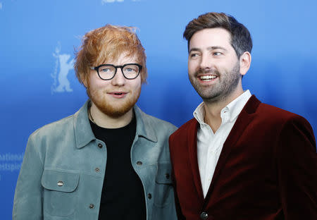 Director, screenwriter, editor and producer Murray Cummings and Ed Sheeran pose during a photocall to promote the movie Songwriter at the 68th Berlinale International Film Festival in Berlin, Germany, February 23, 2018. REUTERS/Fabrizio Bensch