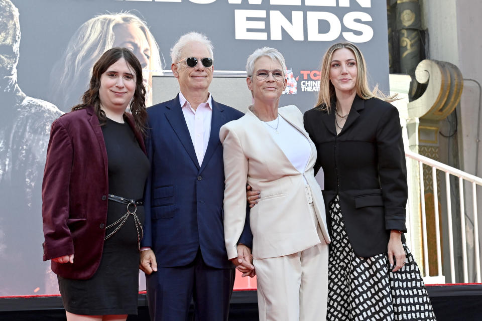 Jamie poses with her husband, Ruby, and other daughter