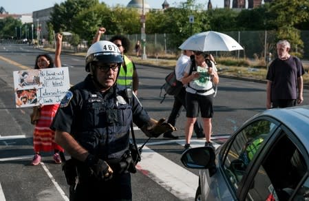 Climate change activists call block key buildings and roads in Washington D.C.