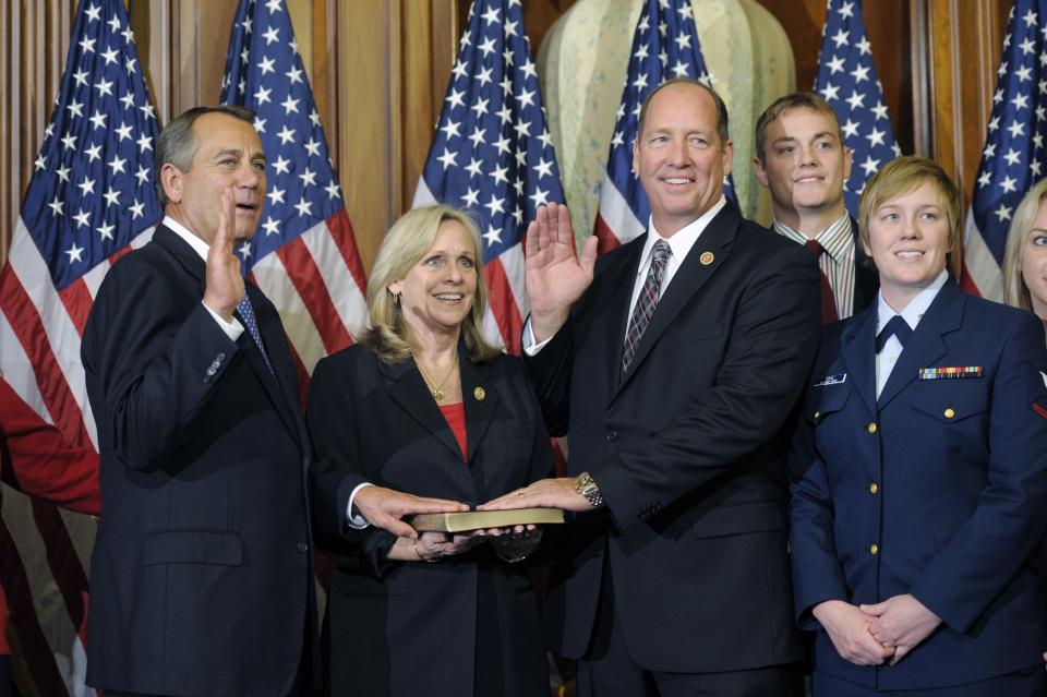 House Speaker John Boehner of Ohio, left, performs a mock swearing in for Rep. Ted Yoho, R-Fla., third from left, Thursday, Jan. 3, 2013, on Capitol Hill in Washington as the 113th Congress began. (AP Photo/Cliff Owen) 