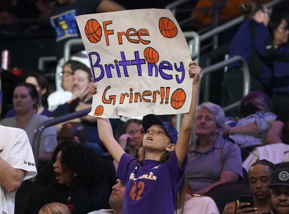 A young Phoenix Mercury fan holds up a sign "Free Brittney Griner" during a WNBA basketball game against the Las Vegas Aces, Friday, May 6, 2022, in Phoenix. Griner has been detained in Russia since Feb. 17 after authorities at the Moscow airport said they found vape cartridges that allegedly contained oil derived from cannabis in her luggage. (AP Photo/Darryl Webb)