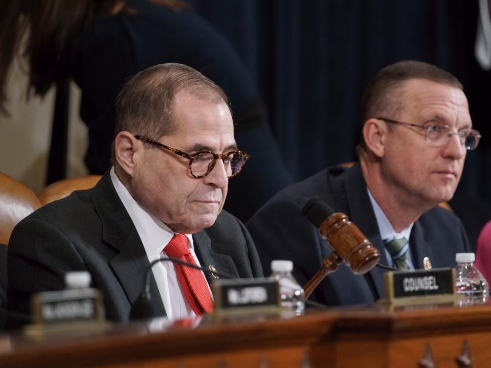 House Judiciary Committee Chairman Jerrold Nadler, D-N.Y., left, joined by Rep. Doug Collins, R-Ga., the ranking member, using his gavel to call for order as he convenes a hearing to hear investigative findings in the impeachment inquiry against President Donald Trump, on Capitol Hill in Washington, Monday, Dec. 9, 2019. (AP Photo/J. Scott Applewhite)