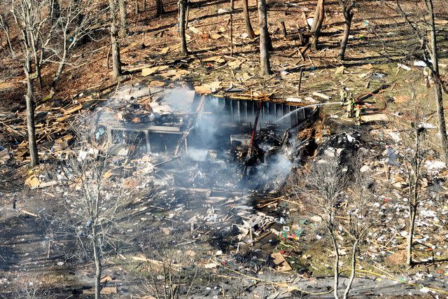 <p>Tim Robbibaro/Pittsburgh Post-Gazette via AP</p> Debris remains after a house explosion on Tuesday, March 12, 2024 in Crescent Township, Pa.