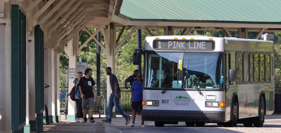 Riders exit the Pink Line Gastonia Transit bus at Bradley Station Thursday afternoon, Oct. 8, 2020.