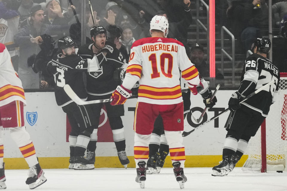 Los Angeles Kings right wing Gabriel Vilardi (13) celebrates with right wing Viktor Arvidsson (33) after scoring during the first period of an NHL hockey game against the Calgary Flames Thursday, Dec. 22, 2022, in Los Angeles. (AP Photo/Ashley Landis)