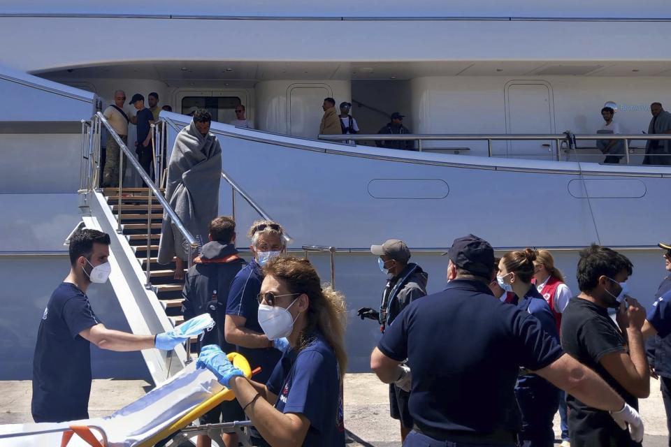 Survivors arrive by yacht after a rescue operation at the port in Kalamata town, about 240 kilometers (150miles) southwest of Athens on Wednesday, June 14, 2023. Authorities say at least 30 people have died after a fishing boat carrying dozens of migrants capsized and sank off the southern coast of Greece. A large search and rescue operation is underway. Authorities said 104 people have been rescued so far following the incident early Wednesday some 75 kilometers (46 miles) southwest of Greece’s southern Peloponnese region.(www.argolikeseidhseis.gr via AP)