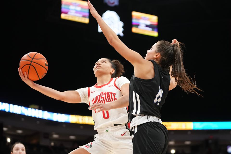 Ohio State guard Madison Greene shoots around Grand Valley State's Ellie Droste on Friday.