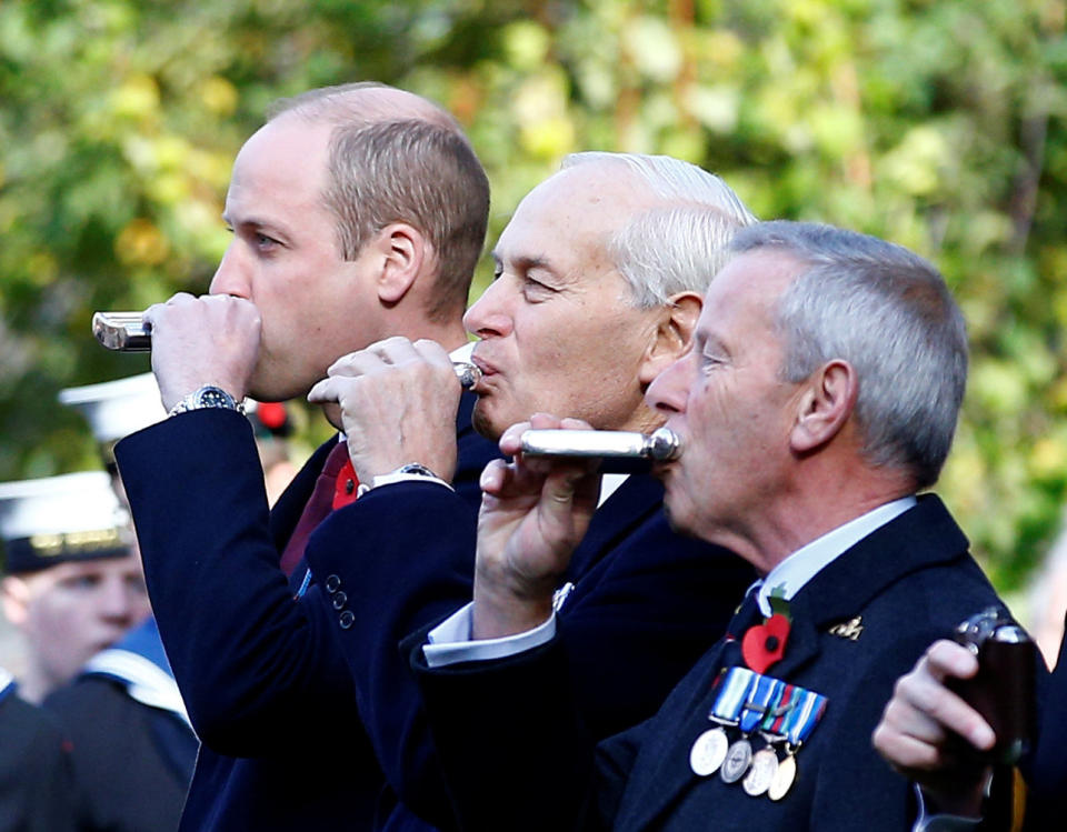 The Duke of Cambridge drinks from a hipflask during the Submariners’ Remembrance Service and Parade, at Middle Temple, London (PA)