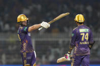 Kolkata Knight Riders' Phil Salt, left, celebrates scoring fifty runs during the Indian Premier League cricket match between Delhi Capitals and Kolkata Knight Riders in Kolkata, India, Monday, April 29, 2024. (AP Photo/Bikas Das)