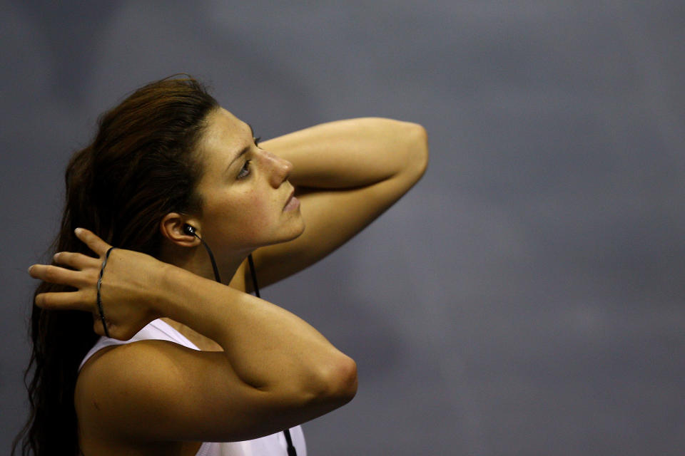 SHANGHAI, CHINA - JULY 23: Stephanie Rice of Australia ties her hair back prior to putting on her cap during a swimming training session on Day Eight of the 14th FINA World Championships at the Crown Indoor Stadium on the grounds of the Oriental Sports Center on July 23, 2011 in Shanghai, China. (Photo by Quinn Rooney/Getty Images)