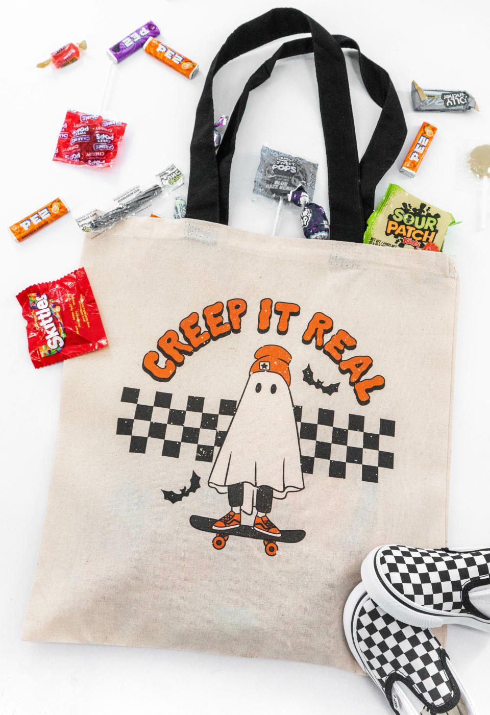 <p><a href="https://aspen-company.com/get-in-loser-trick-or-treat-tote-bag/?gc_id=20159322238&gclid=Cj0KCQjw1_SkBhDwARIsANbGpFtuwZMU-IUjW8fpmRaL8xg1VgsXoilmNcvC3GrvN5Ihqg1kdxBXUfIaAimhEALw_wcB" rel="nofollow noopener" target="_blank" data-ylk="slk:Shop Now;elm:context_link;itc:0;sec:content-canvas" class="link ">Shop Now</a></p><p>Creep it Real Trick-or-Treat Bag</p><p>$16.00</p><p>aspen-company.com</p><span class="copyright">Aspen + Company</span>