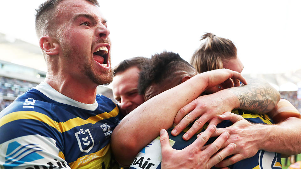 The Parramatta Eels, pictured celebrating a try, gave the Brisbane Broncos a historic thumping in their NRL elimination final.