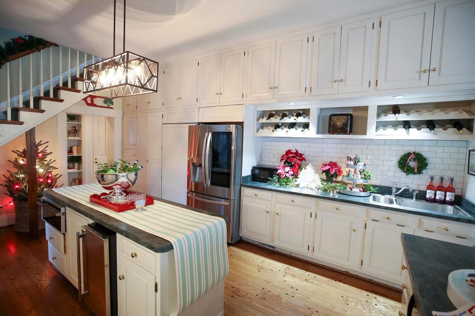 The kitchen at Chestnut Hall, a historic farmhouse in Kentucky, is full of Christmas decor.